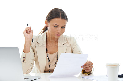 Buy stock photo A beautiful young businesswoman reading a document while isolated on a white background