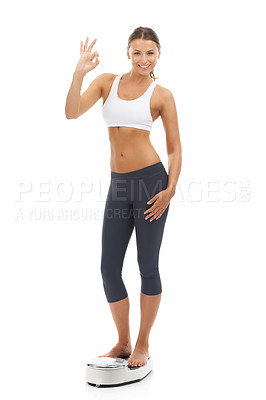 Buy stock photo Studio portrait, scale or happy woman with okay gesture for weight loss progress, healthy lifestyle or body transformation goals. Well done, model or ok icon for good diet results on white background