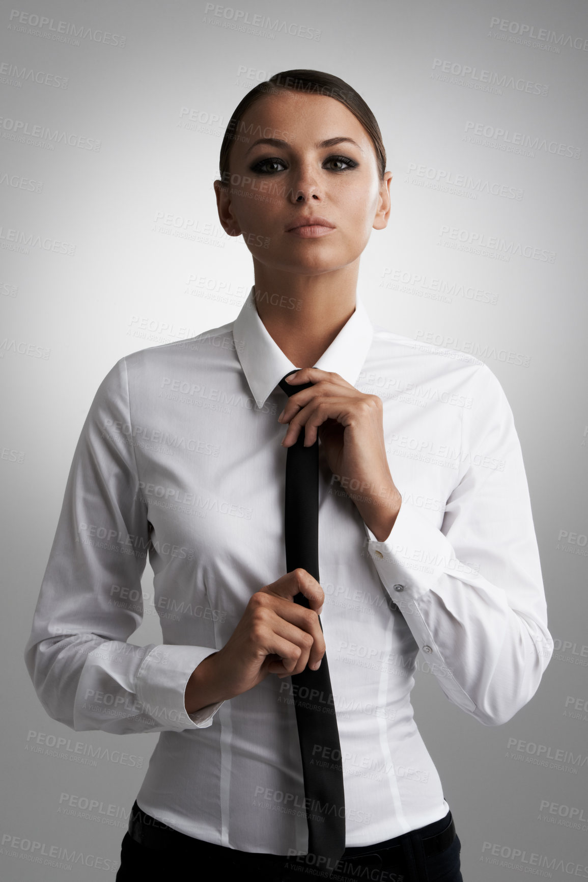 Buy stock photo Portrait, business and woman adjust tie in studio isolated on a gray background. Face, confidence and professional straighten clothes, shirt for style and beauty of serious fashion model in Brazil