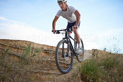 Buy stock photo Man, cyclist and mountain bicycle for exercise, training and energy for rider, cycling and sport. Outdoor, hobby and fitness in nature, trail and active for wellness, helmet and physical workout