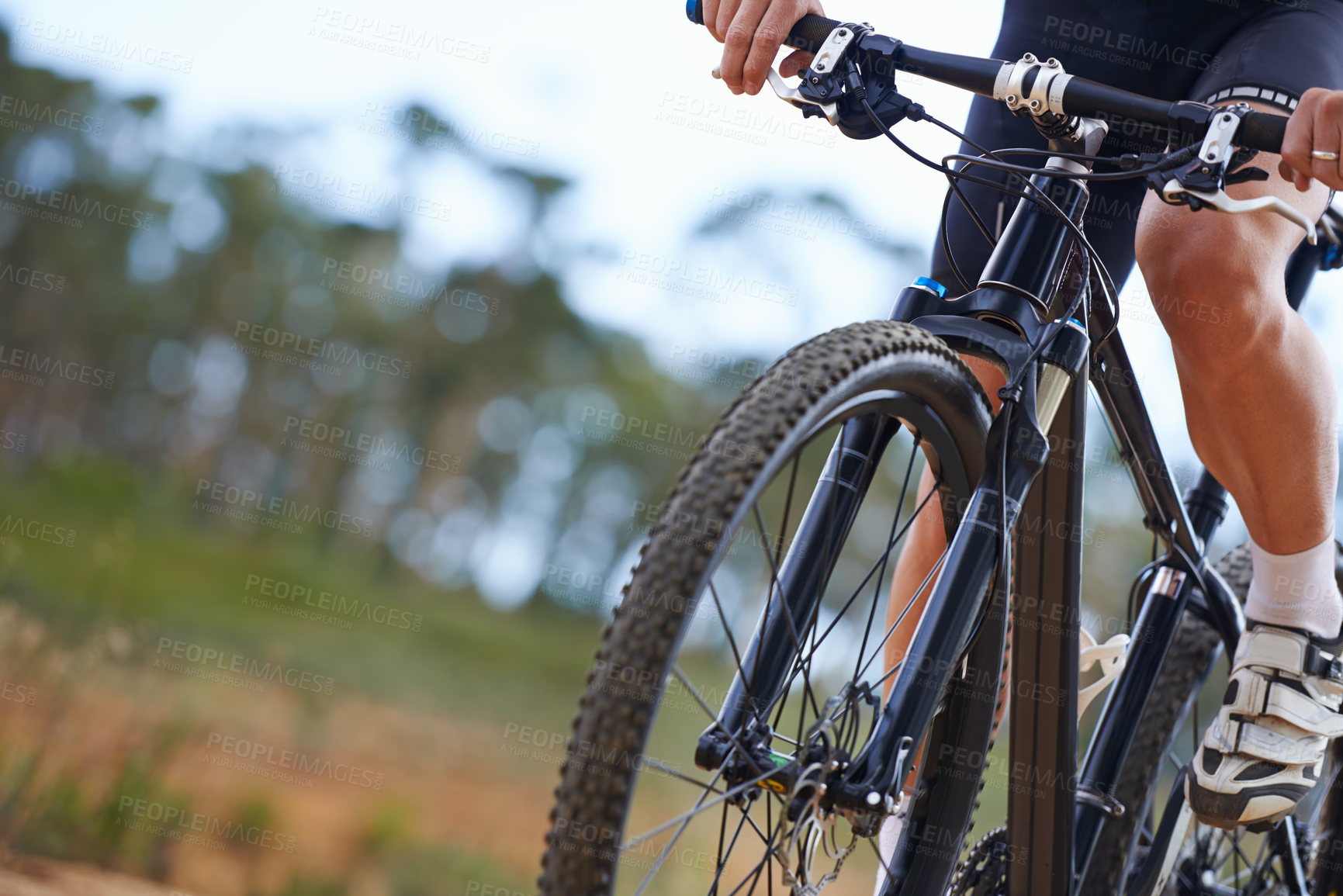 Buy stock photo Hands, bicycle and gear in nature for cycling adventure on off road terrain for extreme sport, performance or cardio. Person, fingers and shifter on mountain gravel or racing, competition or training