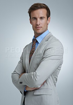 Buy stock photo Portrait, serious and business man with arms crossed for pride in corporate career. Face, confident professional lawyer and attorney working in a suit isolated on gray studio background in Australia