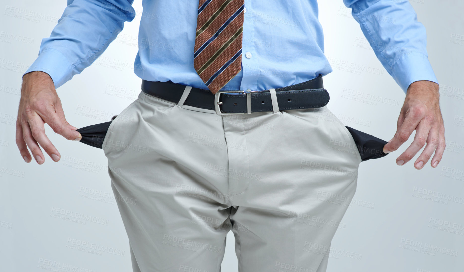 Buy stock photo Businessperson, empty pocket and poor in studio, unemployment and bankruptcy by white background. Closeup, no money and financial trouble or bad investment, stock market crash and debt or broke