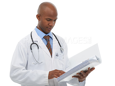 Buy stock photo A young doctor looking over your medical paperwork