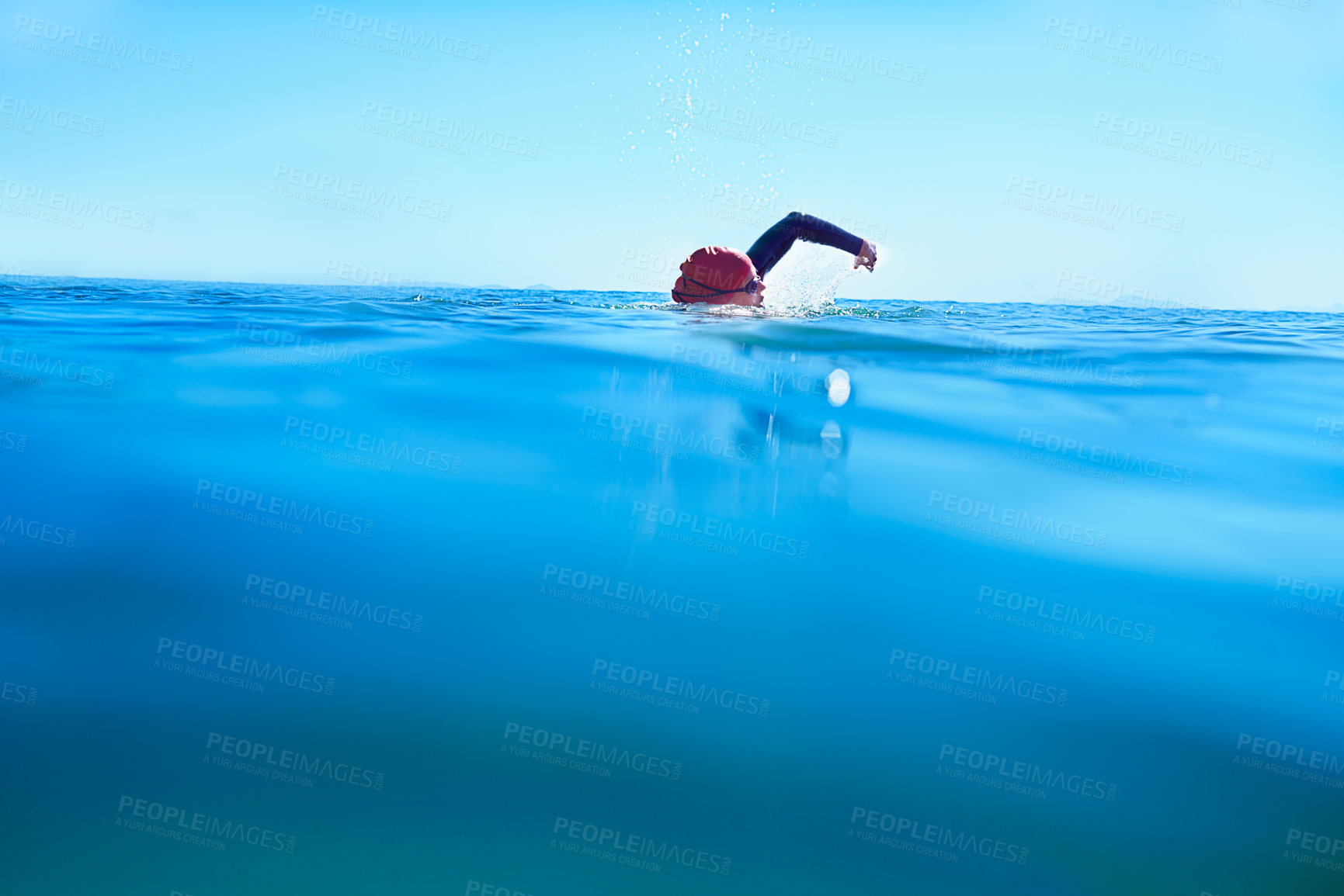 Buy stock photo Swimming, stroke and person in sea water in summer for exercise, training or workout on mockup space. Ocean, sport and a athlete crawl outdoor for fitness, health and triathlon competition in nature
