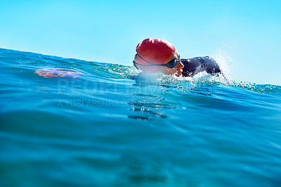 Buy stock photo Shot of a swimmer in the open ocean