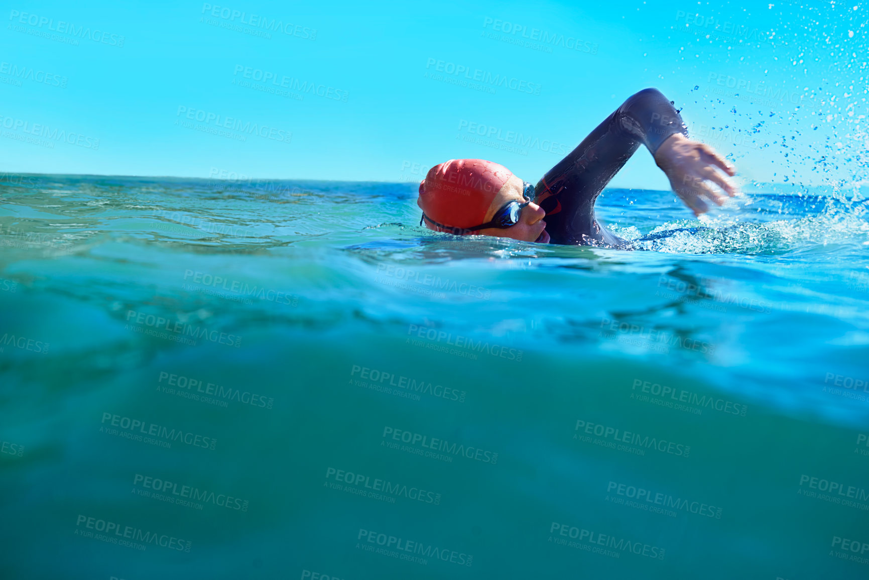 Buy stock photo Swimming, crawl and person in ocean water in summer for exercise, training or workout on mockup space. Sea, sport and a young athlete outdoor for fitness, health and triathlon competition in nature