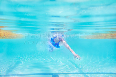 Buy stock photo Underwater shot of a female swimmer