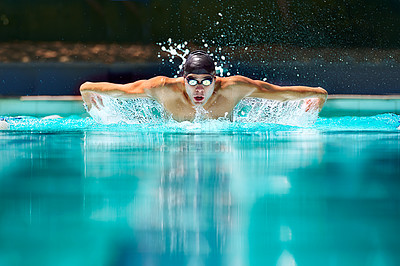 Buy stock photo Fitness, sport and training with man in swimming pool for competition, workout and energy. Strong, water splash and cardio with male swimmer and practice for athlete, championship and race at gala