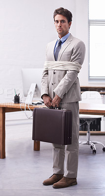 Buy stock photo Portrait of businessman in workplace tied up in rope with depression, control and sad in law firm. Serious attorney, lawyer or legal consultant bound in office, corporate hostage with bag and stress.