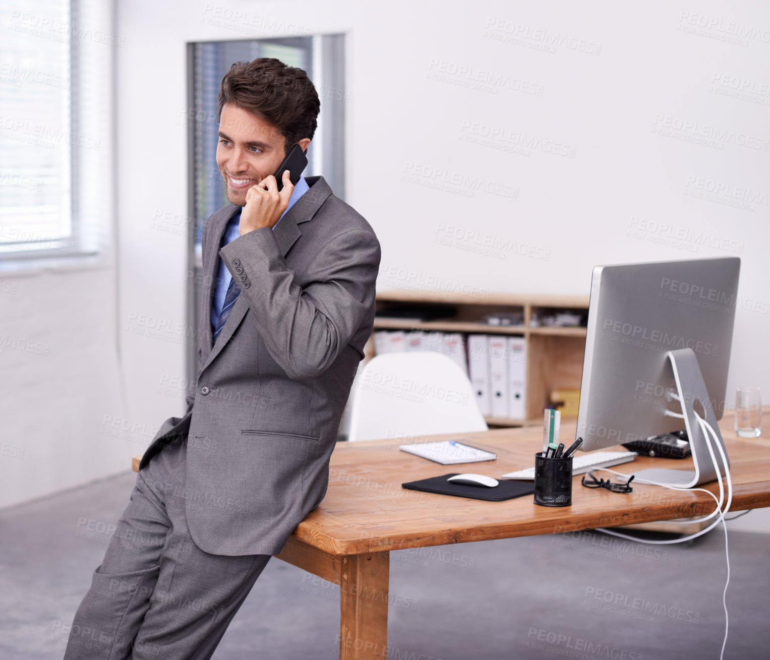 Buy stock photo Businessman, happy or phone call in office by desk, communication or desktop on table in corporate career. Accountant, professional or positive on smartphone, technology or networking in formal suit