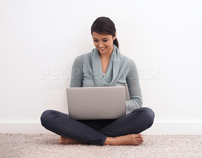 Buy stock photo Happy woman, laptop and relax on floor for communication, email or online research at home. Young female person or freelancer smile in remote work on computer for search, networking or streaming