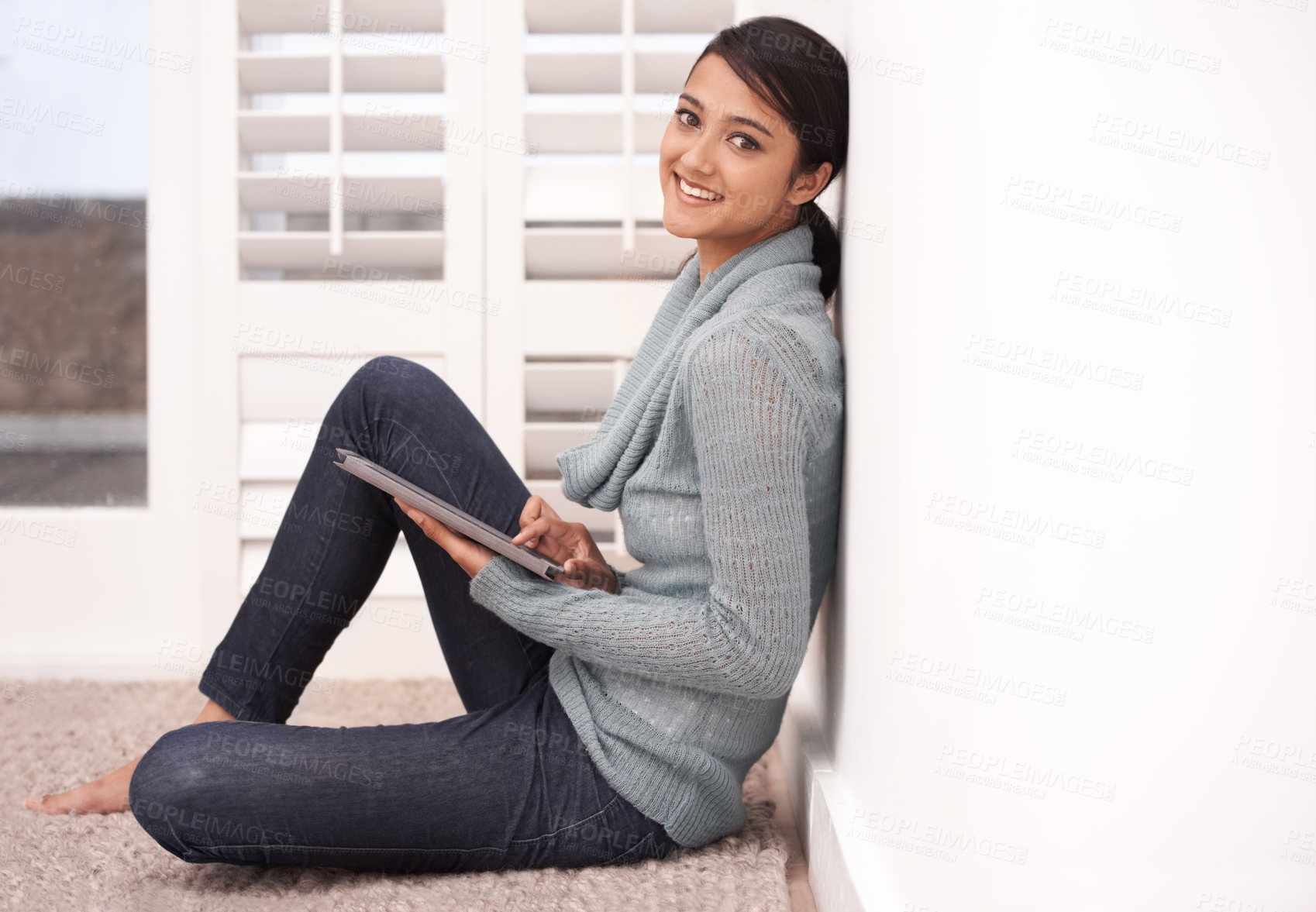 Buy stock photo Portrait of happy woman on carpet in home with tablet, smile and relax with studying, research and social media post. Student girl on floor with digital app, elearning and blog online in living room.