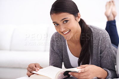 Buy stock photo Portrait of woman, reading book on sofa and learning for home education, literature or language. Young Mexican student relax in living room and lounge with novel or story for knowledge or studying