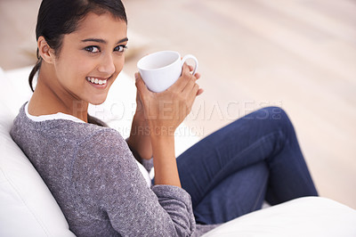 Buy stock photo Coffee, living room and portrait of Indian woman on sofa for relaxing, comfortable and calm in home. Apartment, morning and happy person with mug on couch drinking hot beverage, tea and caffeine