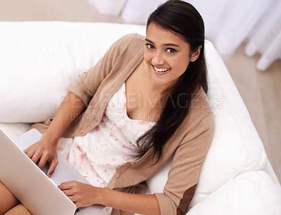 Buy stock photo Portrait of woman on couch with laptop, smile and relax with remote work, website and browse in living room. Happy girl on sofa with computer for freelance job, online research and internet in home.