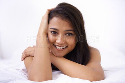 Buy stock photo Woman, bed and relax portrait in the morning with rest and sleep in a home with a smile. Indian female person, bedroom and wake up on duvet with peace and calm in a house on a blanket with comfort