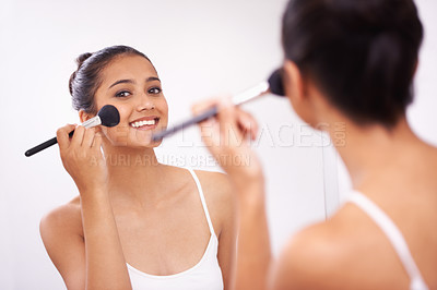 Buy stock photo Happy woman, portrait and makeup brush in mirror for beauty, cosmetics or grooming in bathroom at home. Female person smile or applying foundation, blush or contour for facial treatment in reflection