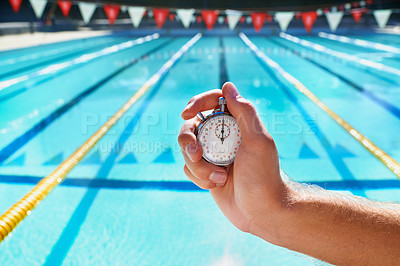 Buy stock photo Hand, stopwatch and swimming pool for sport, training and workout with preparation for competition. Person, coach or mentor with clock, timer or watch for speed, progress and tracking lap for race