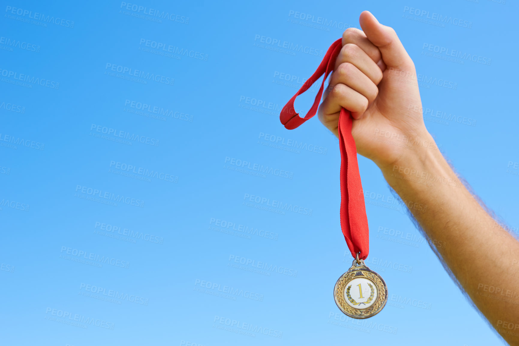 Buy stock photo Gold medal, blue sky and hands of sports person winning award, competition victory or game contest. Race champion, challenge winner and closeup athlete with mockup space, success or prize achievement