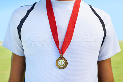 Buy stock photo Cropped shot of a gold medal around an athlete's neck