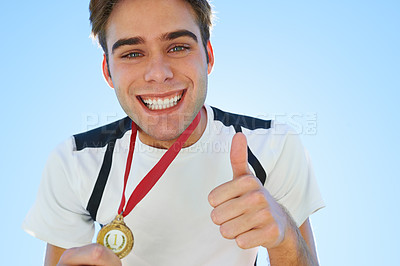 Buy stock photo Winner, man and thumbs up with medal for sports achievement, success and yes in competition. Happy portrait of runner or athlete with like, prize or good job hands, emoji and gold award on a blue sky