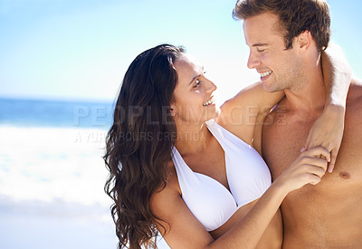 Buy stock photo Hug, love and happy couple at ocean for vacation adventure together on tropical island with blue sky. Smile, man and woman on beach holiday with waves, embrace and mockup on romantic travel in Hawaii