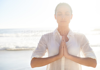 Buy stock photo A beautiful young woman meditating outside