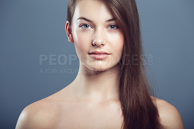 Buy stock photo Skin, beauty and face portrait of a woman in studio with natural makeup and cosmetics. Headshot of aesthetic gen z female model on a grey background for glow, hair care and facial dermatology shine