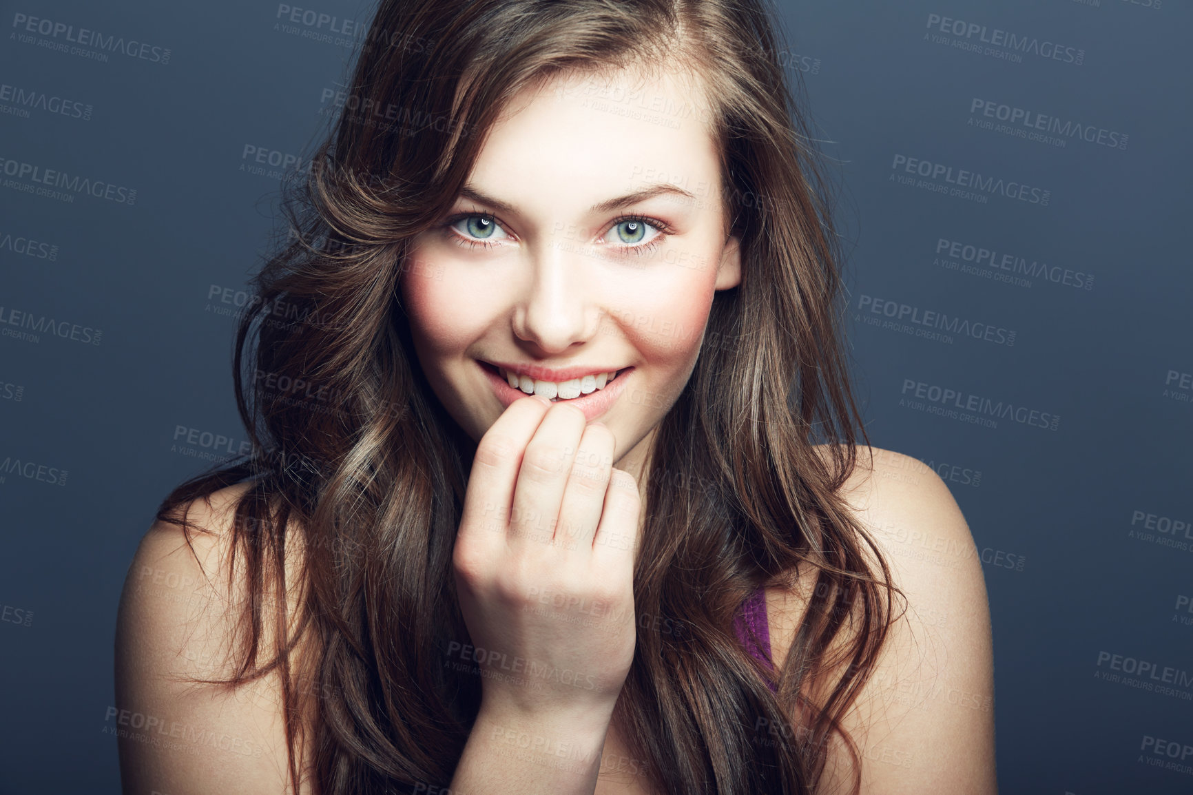 Buy stock photo Beauty, face and skin portrait of a woman in studio with a smile, makeup and cosmetics. Headshot of a happy gen z female model on a grey background for natural glow, hair care and dermatology