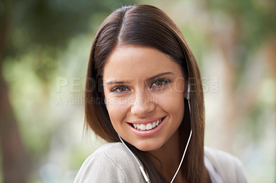 Buy stock photo Woman, portrait and earphones for music entertainment or streaming, audio or listening. Female person, face and smile for electronic playlist sound in nature park for holiday relax, podcast or radio