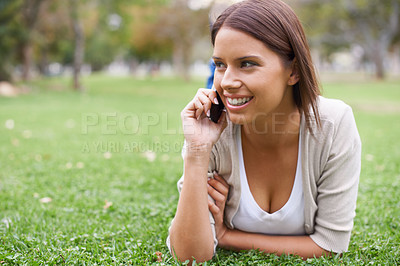 Buy stock photo Woman, phone call and relax on grass talking for communication, good news or gossip. Female person, smile and digital device in forest for holiday rest or laughing conversation, vacation or nature