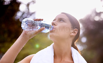 Buy stock photo Nature, fitness or woman drinking water for running outside with a towel in exercise for resting break. Training, runner or outdoor workout with liquid, person or female athlete in park for energy