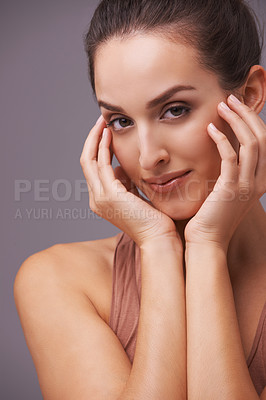 Buy stock photo Portrait, beauty and aesthetic with natural woman in studio on gray background for wellness or dermatology. Skincare, makeup or cosmetics with hands of young person on face for antiaging treatment