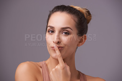 Buy stock photo Portrait of happy woman, touching lips or silence for secret, silence or privacy on grey background. Mouth, natural face or confident model isolated in studio with beauty for skincare or wellness