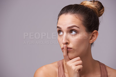 Buy stock photo Woman thinking, touching lips or silence for secret, or privacy in gossip on grey background. Mouth, natural face or confident model isolated in studio with beauty for skincare or wellness