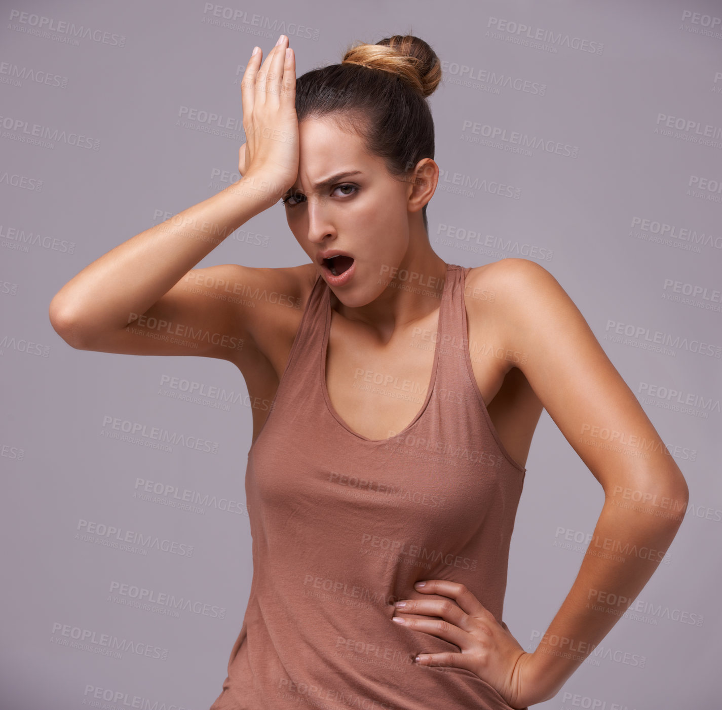 Buy stock photo An attractive young woman against a purple background