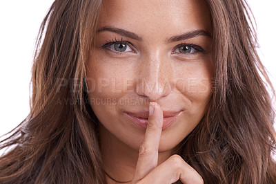 Buy stock photo Secret, portrait and woman with finger on lips in studio for quiet gesture, hush or whisper expression. Face, smile and female model with emoji for gossip, mouth or noise, confidential or drama