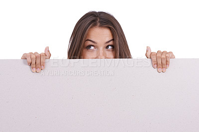 Buy stock photo Poster, mockup or eyes of woman in studio with space for advertising, news and info on white background. Empty, banner or female model behind blank paper billboard presentation, board or announcement