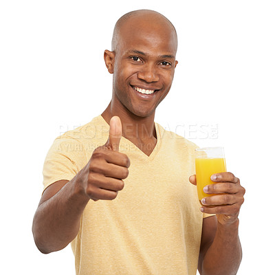 Buy stock photo Studio shot of a handsome African-American man giving the thumbs-up while holding a glass of orange juice