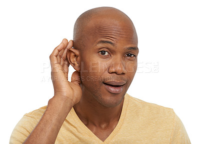 Buy stock photo A young ethnic man holding his hand cupped against his ear - portrait