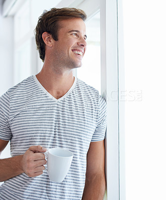 Buy stock photo Man, coffee cup and happy for thinking by window in home, vision or idea with drink, choice and remember in morning. Person, tea and smile with view for memory, decision or relax on holiday in house
