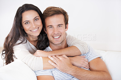 Buy stock photo Portrait, couple hug and love, relax on sofa with trust, marriage and happy at home for healthy relationship. People bonding, loyalty and connection with smile, partner and romance together at house