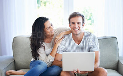 Buy stock photo Couple, love and relax on sofa with laptop, living room and marriage for care bonding on weekend. Woman, man and romantic for relationship with streaming internet, commitment and happy in apartment