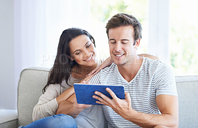 Buy stock photo Couple, tablet and watch movies on sofa with love, living room and wellness in marriage for bonding. Woman, man and smile for relationship care on subscription, weekend and streaming video in home