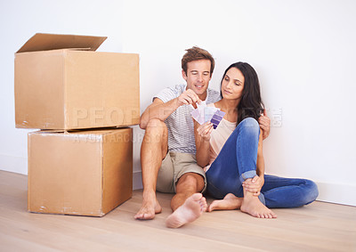 Buy stock photo Couple, color swatches and decision, new home and interior design and real estate. Property, planning renovation and people moving with boxes and investment, mortgage and palette for choice for paint