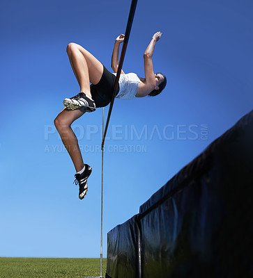 Buy stock photo Woman, high jump and athlete leap for sport training outdoor for competition, endurance or practice. Female person, workouts and agility for cardio exercise or contest fitness, blue sky or flexible