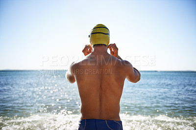 Buy stock photo Sports, sea and back of man for swimming exercise, workout or training routine in beach, nature or water. Wellness, active and person ready to start challenge, fitness contest or triathlon practice