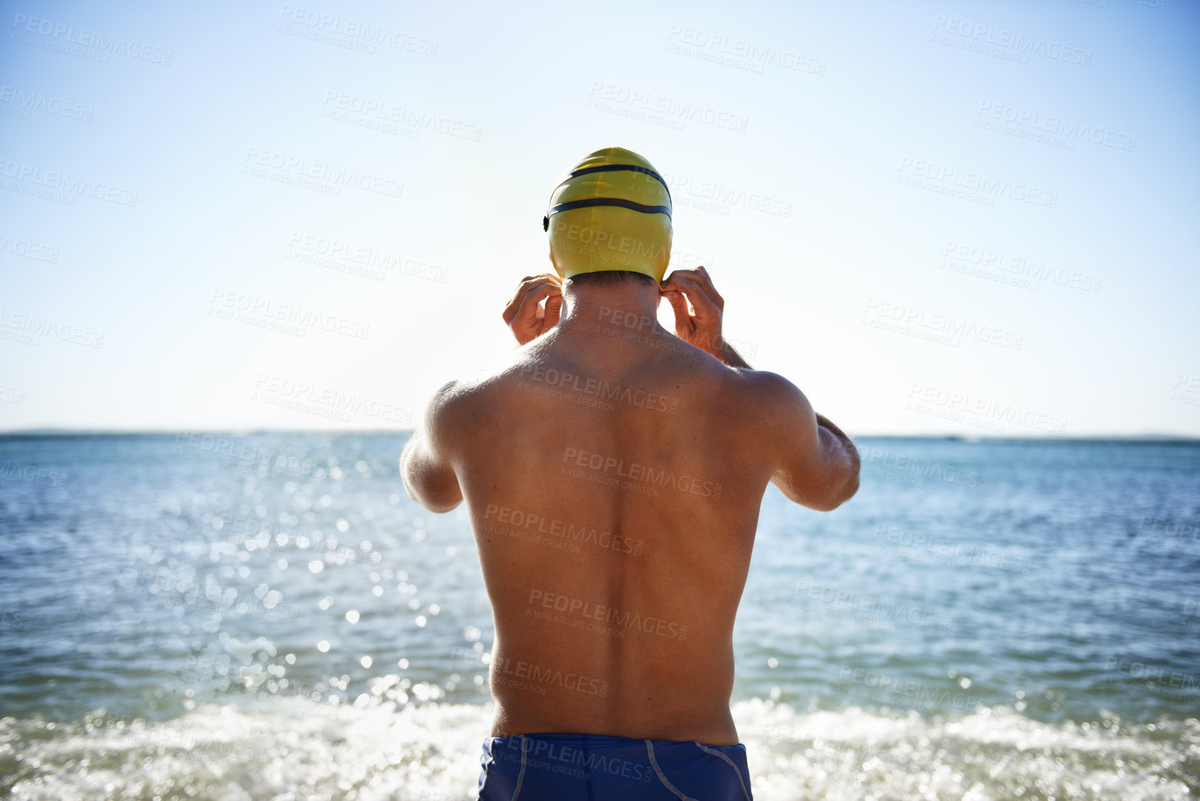 Buy stock photo Sports, sea and back of man for swimming exercise, workout or training routine in beach, nature or water. Wellness, active and person ready to start challenge, fitness contest or triathlon practice