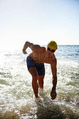 Buy stock photo Sports, sea waves and man for swimming exercise, workout or training routine in beach, nature or ocean. Mockup space, sky and person ready for cardio, fitness or triathlon practice in water splash